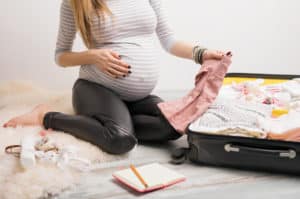 Pregnant Mom of twins packing hospital bag