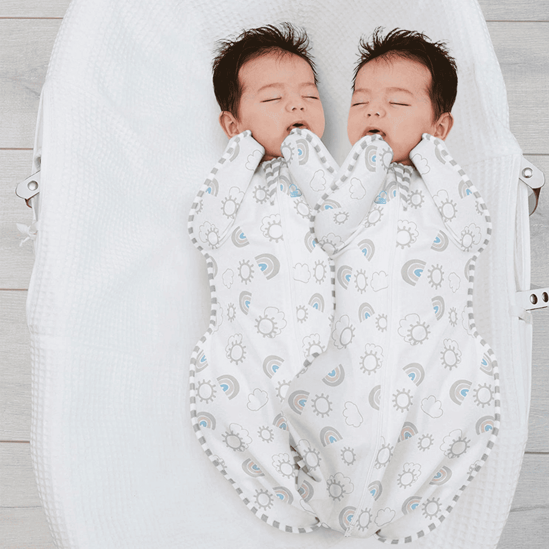 Twins swaddled in sleep sacks